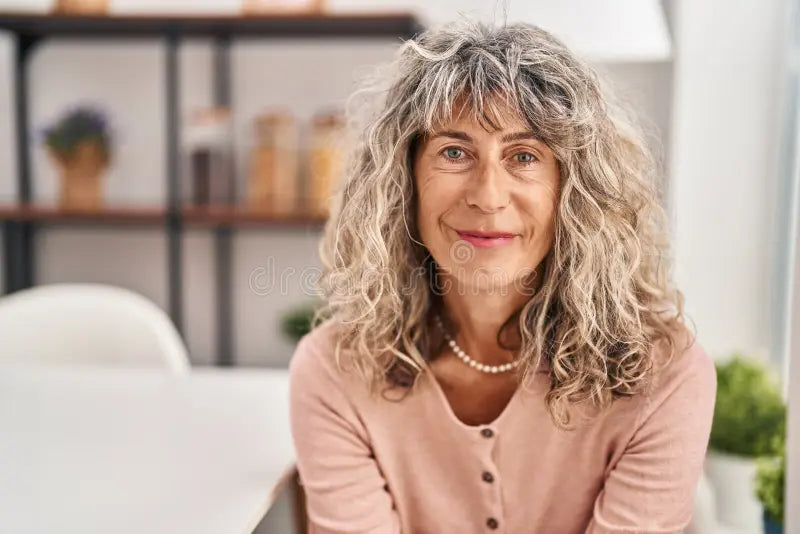 files/middle-age-woman-smiling-confident-sitting-chair-home-258630749.webp